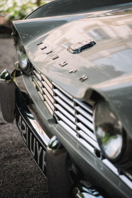 Vintage Triumph chrome hood detail with embossed logo