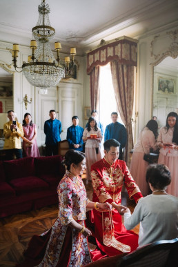 Couple wearing traditional attire taking part in a Japanese tea ceremony during their wedding. Wedding Videographer Japan.