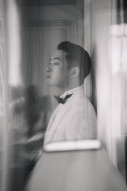 Japanese couple laughing together during cherry blossom pre wedding photo session