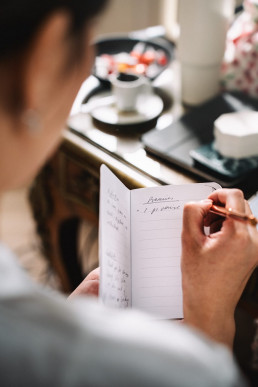 Japanese groom sharing a quiet moment with parents before wedding ceremony