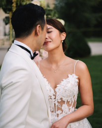 Japanese couple celebrating with family during traditional wedding reception in Japan