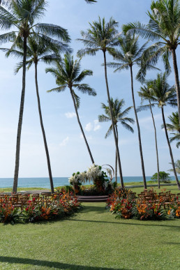 Palm tree lined beach wedding aisle facing ocean in Gili Islands, Indonesia, destination wedding photographer ceremony setup