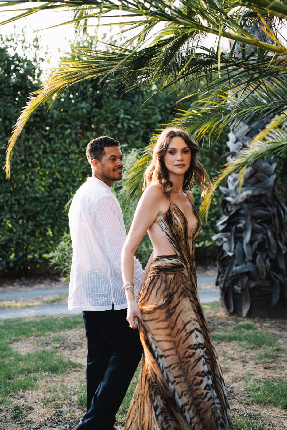 Stylish couple portrait in tropical garden setting in Bali, Indonesia, destination wedding videographer editorial shot