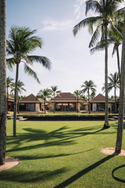 Luxury beachfront villa garden with palm trees for wedding reception in Bali, Indonesia, destination wedding videographer venue