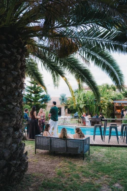 Tropical wedding venue beneath palm trees prepared for a multi-day destination wedding