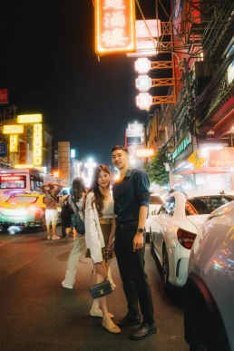 Couple exploring Bangkok at night during the days surrounding their wedding