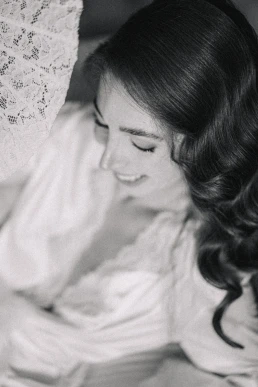 Black-and-white portrait of a bride resting against the groom during their Lake Como elopement