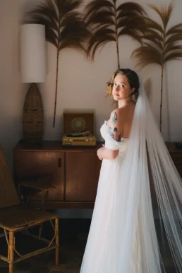 Bride wearing her veil inside an elegant room before her wedding in Chiang Mai, Thailand