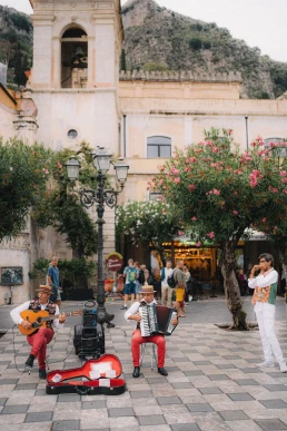 Italian town square with local musicians during a destination elopement