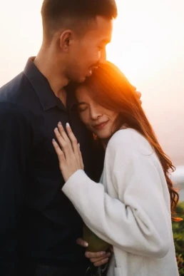 Couple embracing in warm sunset light during their elopement in Krabi, Thailand