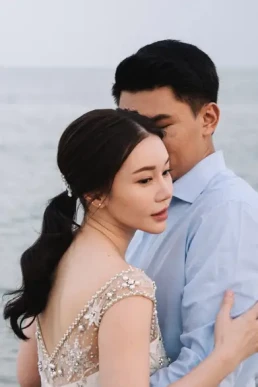 Bride and groom embracing during a beach elopement in Krabi, Thailand