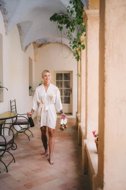 Bride walking through the arched courtyard of a Lake Como wedding venue