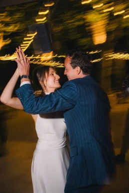 Bride dancing with a guest during the evening reception at Château Valmousse