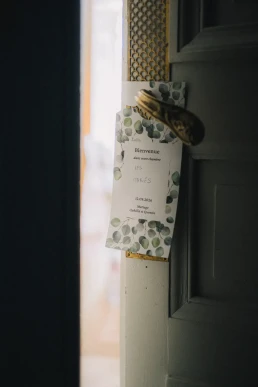 Wedding menu displayed beside a doorway at Château Valmousse