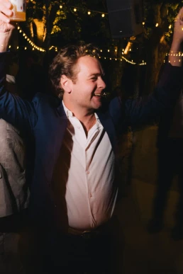 Male wedding guest enjoying the evening reception at Château Valmousse