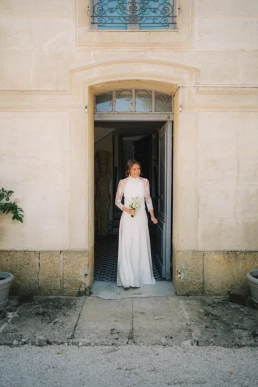 Bride standing in the doorway of a historic stone wedding venue in Scotland