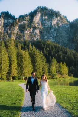 Bride and groom walking through an alpine landscape during their elopement in Switzerland