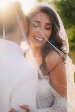 Smiling bride embracing the groom during their Lake Como elopement