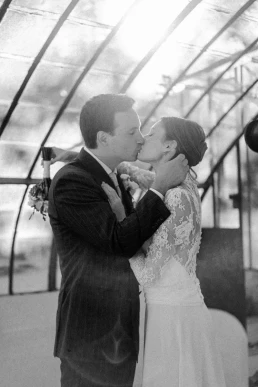 Black-and-white portrait of a bride and groom kissing during their Lake Como elopement