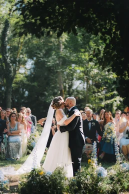 Bride and groom sharing a quiet moment outdoors during their wedding weekend