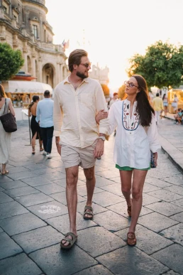 Couple walking together during a relaxed outdoor welcome dinner