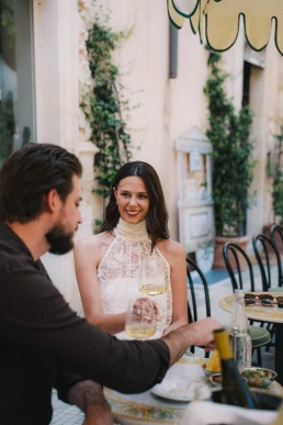 Newlyweds sharing an intimate lunch outdoors after their elopement