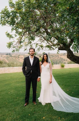 Bride and groom standing together outdoors during a destination wedding in Sicily