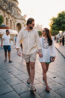 Couple strolling through a Sicilian town during their elopement