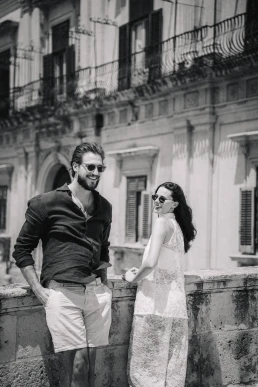Couple walking together through the historic streets of Sicily